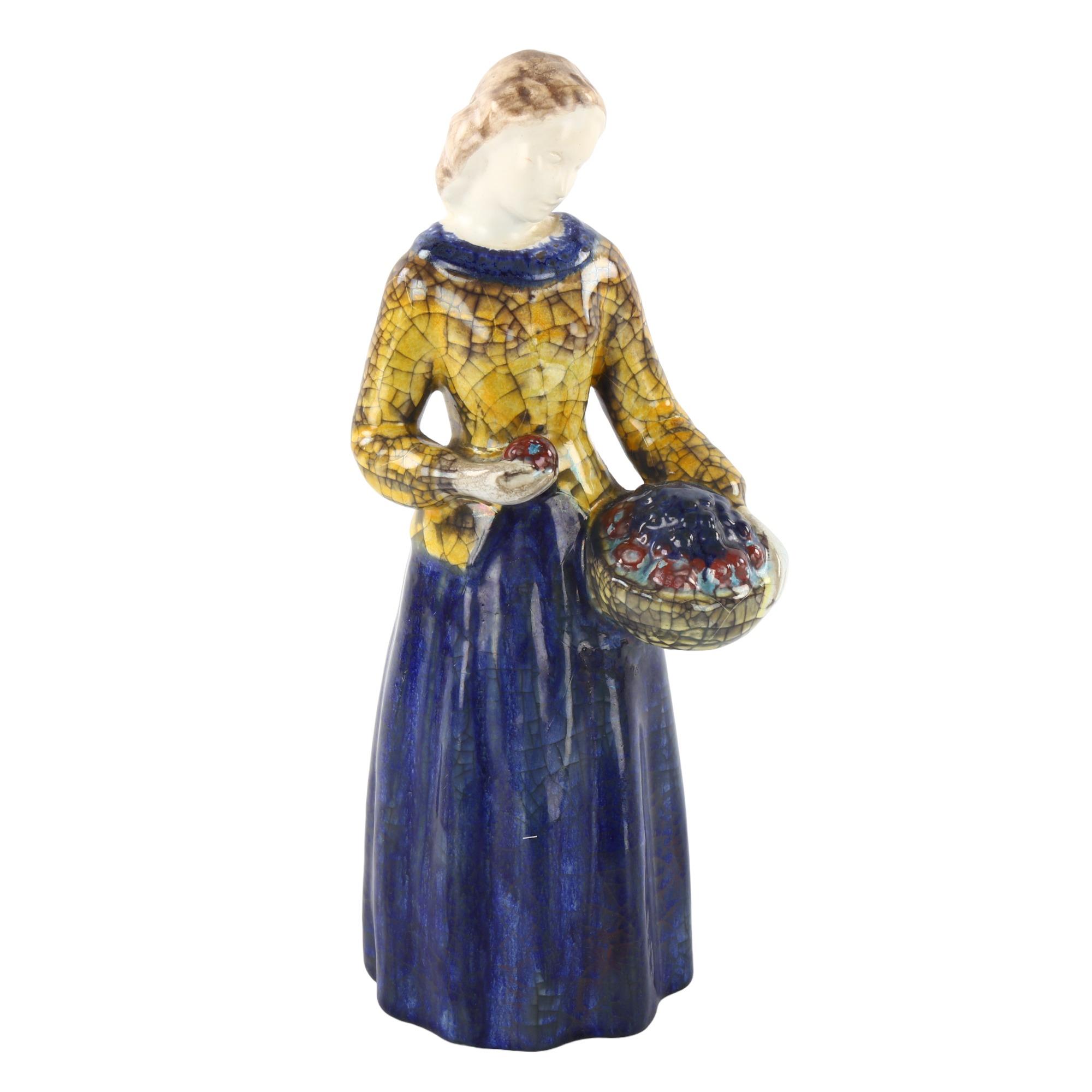 MARIANNE STARCK for Michael Andersen, a Danish pottery figurine of a woman holding a basket of