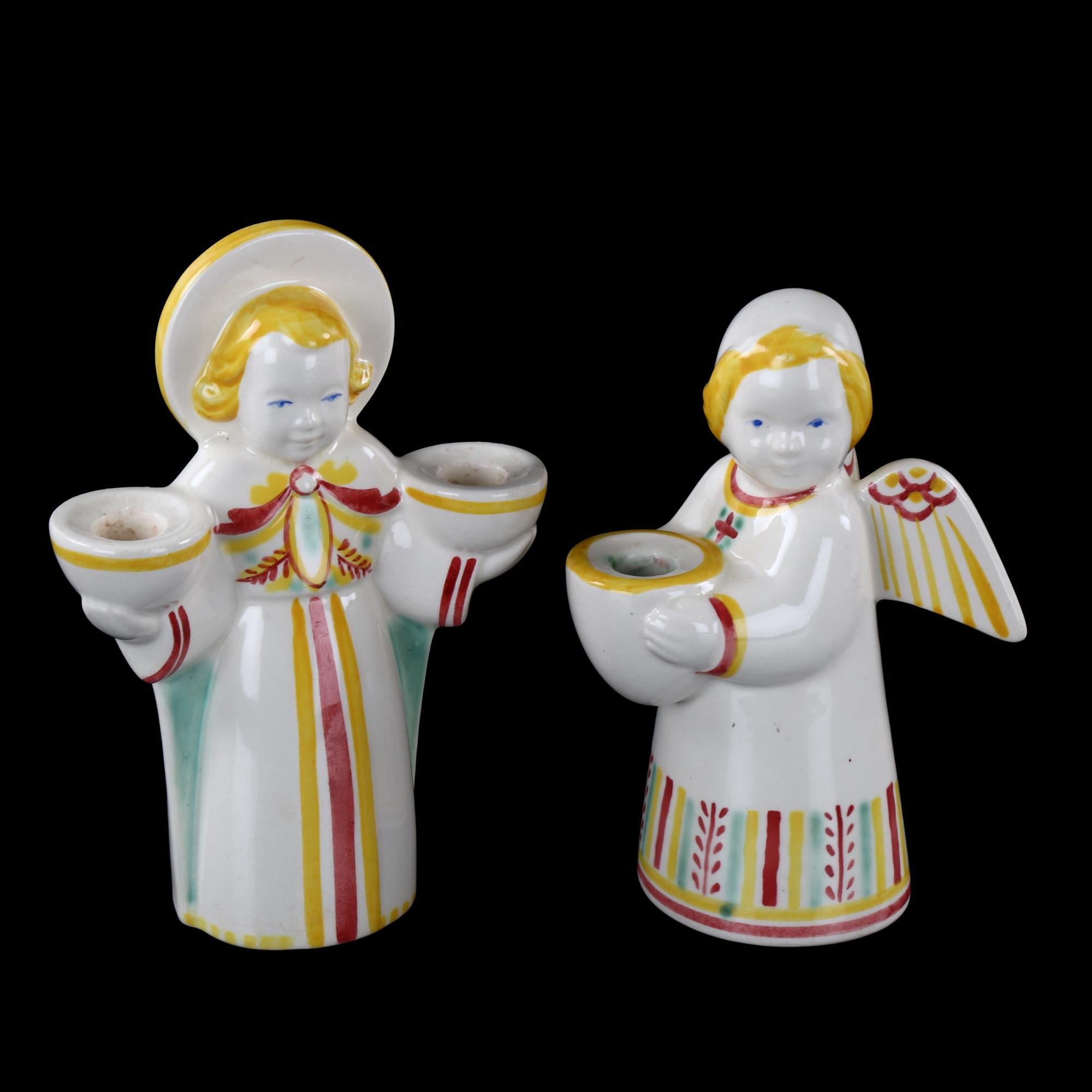 A pair of Royal Copenhagen Christmas Angel candle holders, makers marks to base, tallest 13cm Good