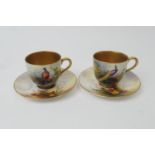 Two Royal Worcester hand decorated cabinets cups and saucers, by Reginald Austin, circa 1926, one