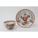 Meissen porcelain tea bowl and saucer, decorated in the kakiemon palette in a fenced garden pattern,