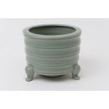 Chinese celadon censer, 20th Century, fluted cylinder form raised on three feet, height 8.5cm, 11.