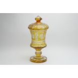 Czechoslovakian amber glass overlay large lidded goblet, with faceted finial, Catherine wheel cut