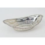 Edwardian silver nut dish, Chester 1902, boat shaped, pierced with scroll border, 26.5cm x 14.5cm,