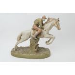 Royal Dux (Bohemia), model of a National Hunt horse and jockey taking a fence, finished in burnished