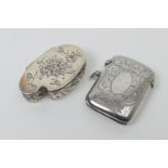George V silver vesta case, Birmingham 1921, curvex form with scroll engraved decoration and
