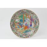 Cantonese famille rose saucer dish, 19th Century, centred with figures within an interior,