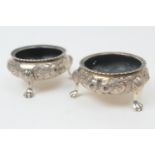 Pair of Victorian silver salt cellars, by Robert Hennell, London 1865, circular form repousse
