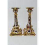 Pair of Royal Crown Derby china candlesticks, pattern no. 1128, in Old Imari colours, height 27cm