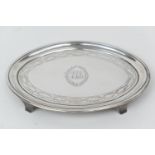 George III silver teapot stand, by John Eames, London 1798, oval form centred with initials,
