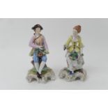 Pair of Dresden porcelain figures, in 18th Century costume, early to mid 20th Century, decorated