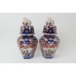 Pair of Japanese Imari lidded vases (Meiji, 1868-1912), hexagonal form with domed cover surmounted