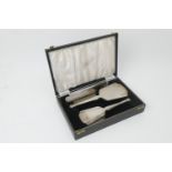 Silver vanity set in the Art Deco style, Birmingham 1956, comprising hand mirror, hairbrush, clothes