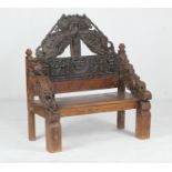 Indian carved wood throne back, with elements that are 18th Century, with later additions, the