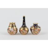Three Royal Crown Derby miniature vases, comprising a Persian inspired miniature bottle vase,