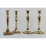 Two pairs of 19th Century brass candlesticks, one pair marked 'WT&S', 28cm and 27cm