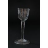 Early George III wine glass, circa 1760, ogee bowl engraved with a bird and floral spray over a