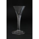 Late George II wine glass, circa 1750, drawn trumpet bowl with air twist stem over a conical foot,