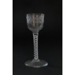 Early George III wine glass, circa 1760, ogee bowl engraved with trailing berries and foliage over