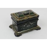 Victorian papier mache tea caddy, circa 1850, decorated with flowers, the leaves picked out in