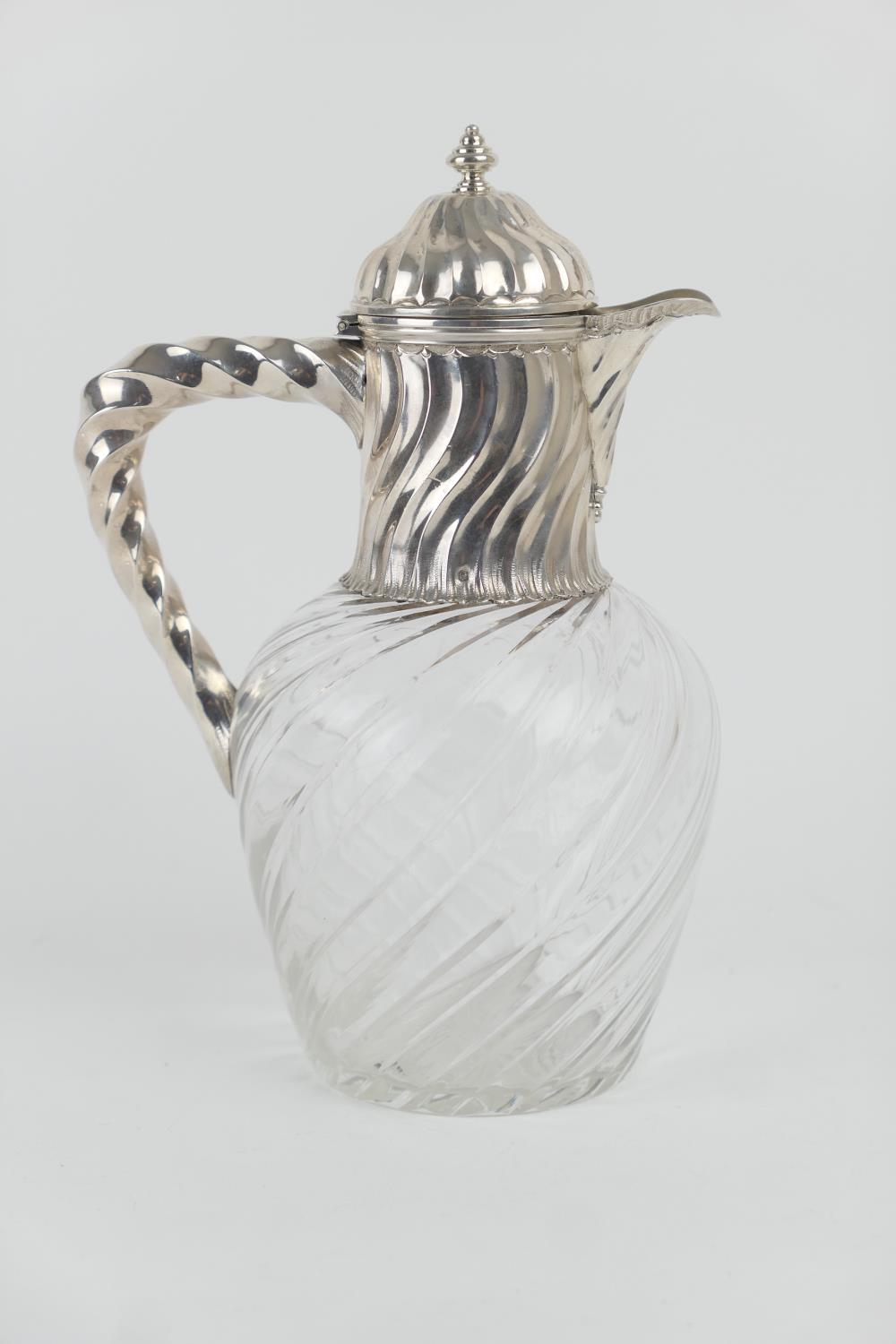 French silver mounted claret jug, circa 1900, domed, hinged cover over a wrythen fluted collar and