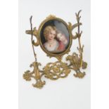 Victorian tooled brass pen stand, centred with a hand painted porcelain plaque of siblings, 17cm x