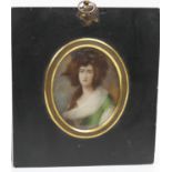 French portrait miniature, circa 1900, featuring a young lady in a green dress with white scarf,