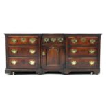 George II oak inverted breakfront dresser, circa 1730-50, two plank top over a central short