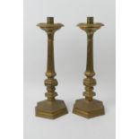 Pair of brass altar candlesticks, hexagonal knopped columns over a hexagonal base, height 53cm