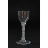 Early George III wine glass, circa 1760, ogee bowl over an opaque twist stem with four thread spiral