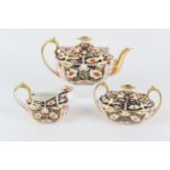 Royal Crown Derby imari tea service, the teapot circa 1894, the sucrier and milk jug 1939, pattern