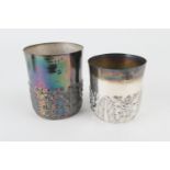 Two continental white metal beakers, each repousse decorated with flowers and acanthus leaves to the