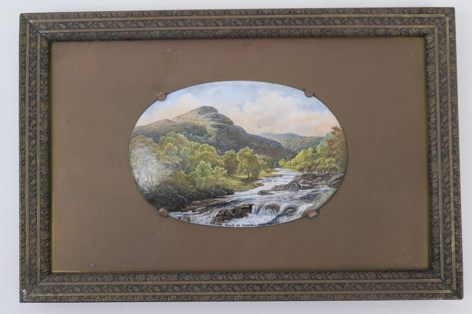 Enamelled river landscape panel, 'The Falls of Tummel, Perthshire', mounted on a brass mount with