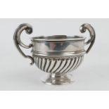 Edwardian silver small twin handled cup, Birmingham 1904, half reeded, 9cm diameter, weight