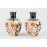 Pair of Royal Crown Derby small ovoid vases, circa 1910/12, each decorated in imari colours, pattern