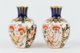 Pair of Royal Crown Derby small ovoid vases, circa 1910/12, each decorated in imari colours, pattern