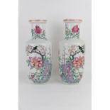 Pair of Chinese famille rose rouleau vases, 18th or 19th Century, decorated with birds seated amidst