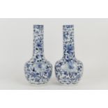 Pair of Chinese blue and white bottle vases, late 19th Century, decorated with butterflies and