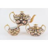 Royal Crown Derby imari tea service, circa 1901 and 1929, pattern 2451, comprising lidded teapot,
