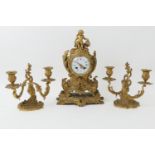 French gilt ormolu clock garniture, circa 1870, the clock in Rococo Revival style surmounted with