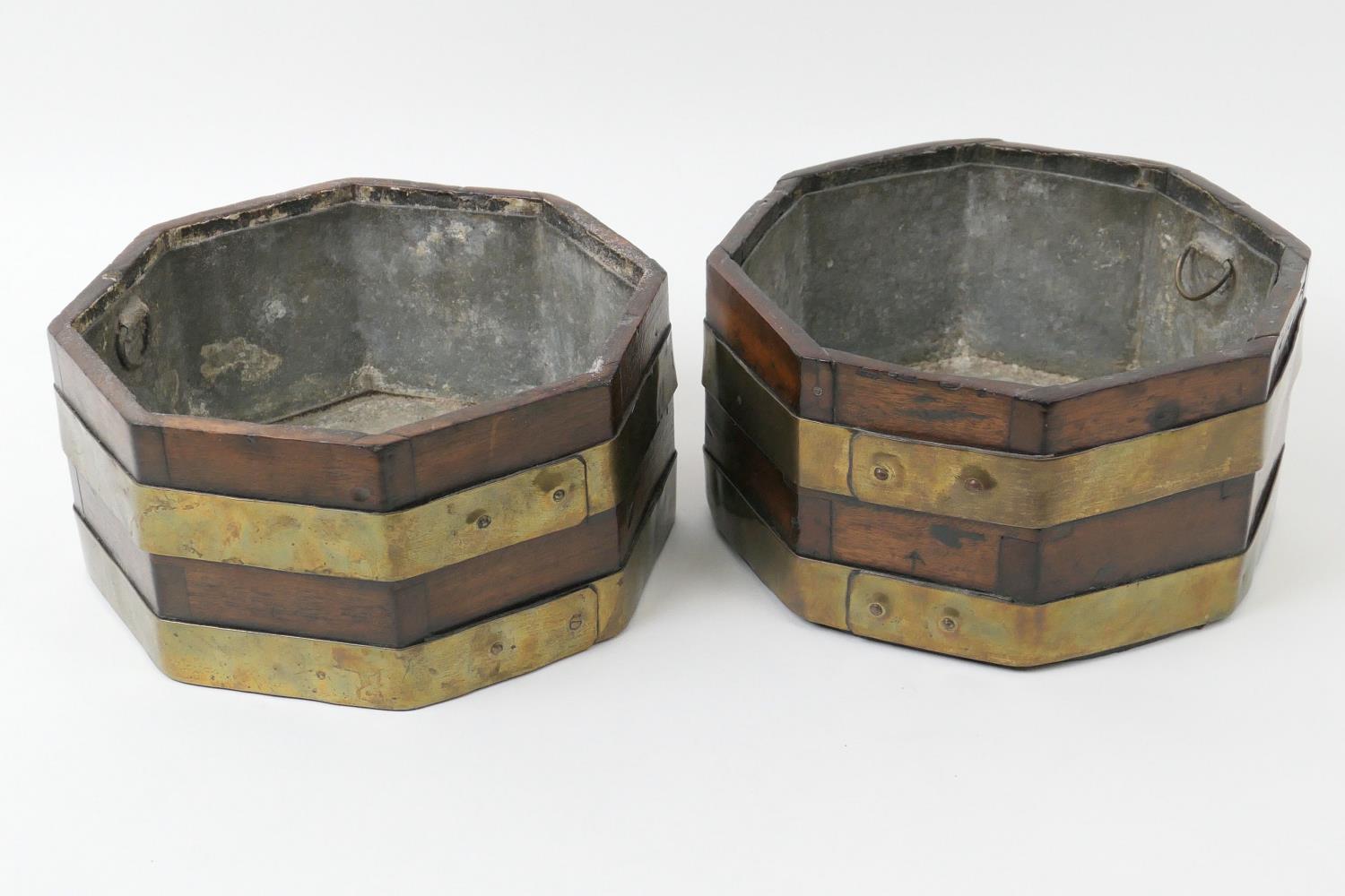 Pair of mahogany and brass bound octagonal wine coolers, each with metal liner, 25.5cm, height 14cm