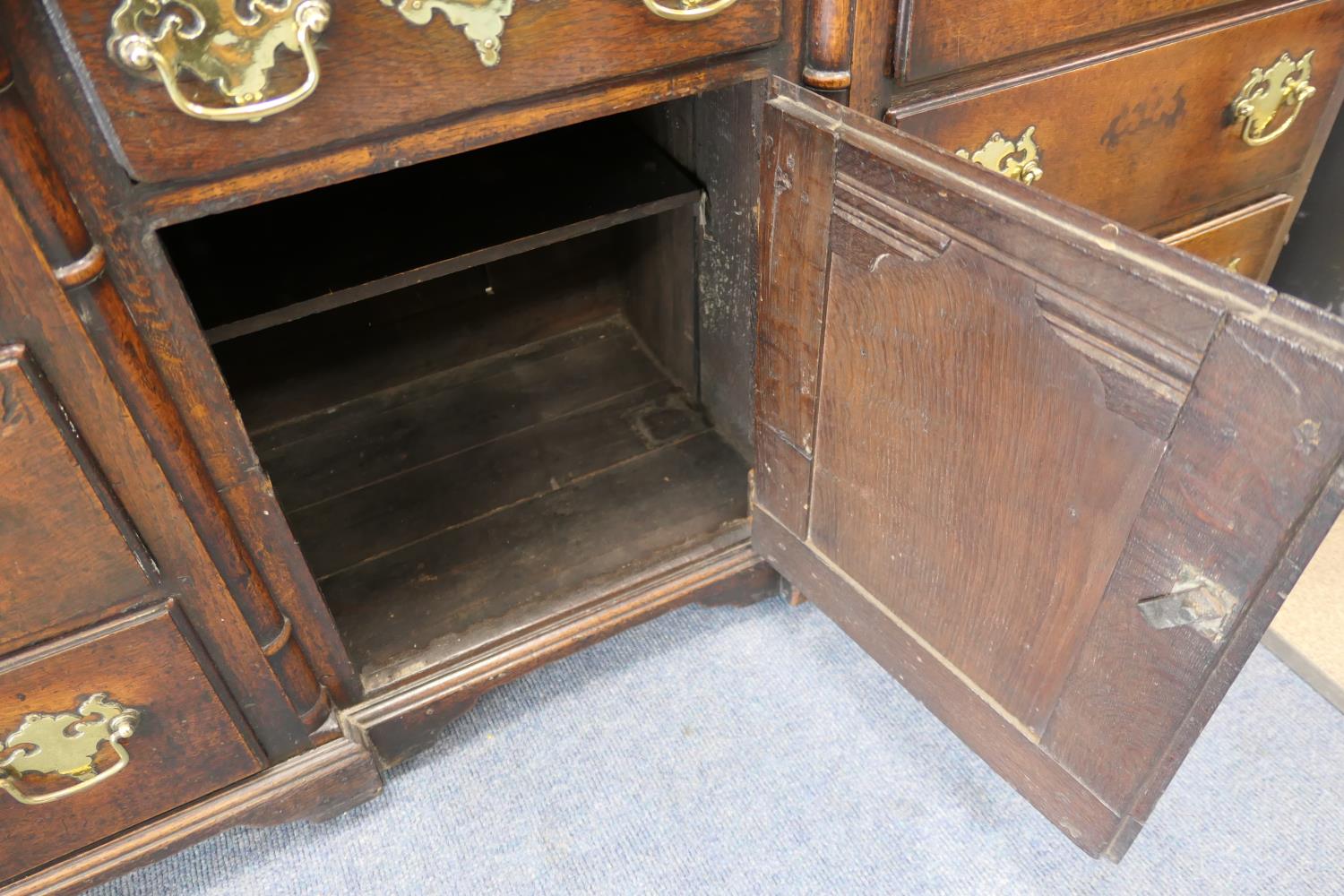 George II oak inverted breakfront dresser, circa 1730-50, two plank top over a central short - Image 4 of 16