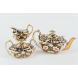 Royal Crown Derby three piece tea service, in traditional imari colours, pattern 2451, circa 1906/