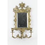 Victorian cast brass girandole, surmounted with an urn and griffons, bevelled glass rectangular