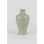 Chinese celadon vase, 20th Century, shouldered form carved beneath the glaze with peony, 17cm