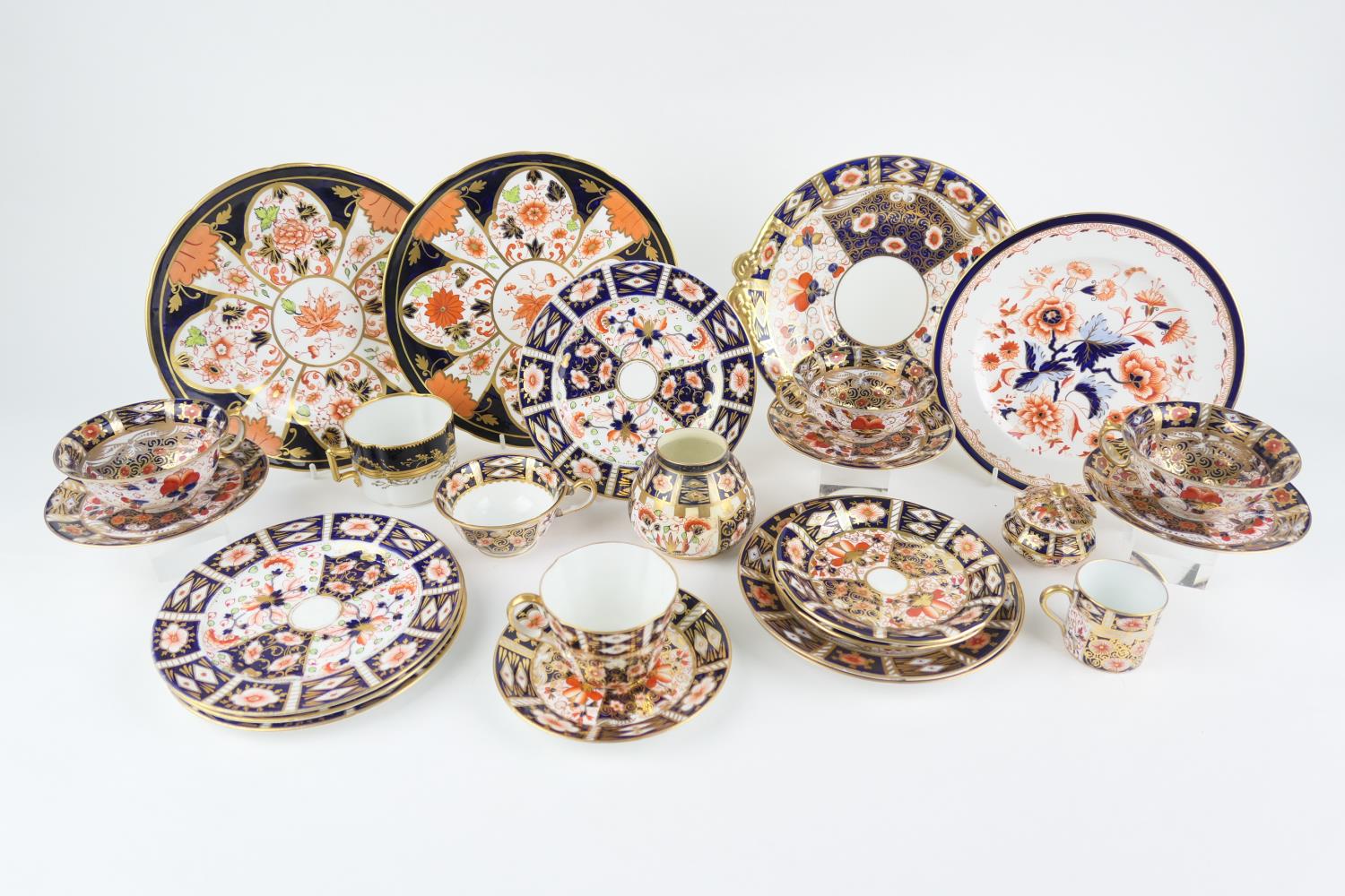 Pair of Royal Crown Derby imari pattern plates, each centred with a leaf, printed marks, 23.5cm