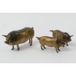 Austrian cold painted bronze pot bellied pig, circa 1900, height 7cm; also two similar, smaller