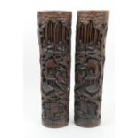 Pair of Chinse carved bamboo brush pots, late 19th Century, worked with figures amidst wooded