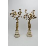 Pair of French gilt ormolu figural candelabra, circa 1880, each with a classical maiden holding
