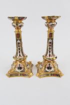 Pair of Royal Crown Derby china candlesticks, pattern no. 1128, in old imari colours, height 27cm