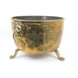 Dutch brass log bin, having lion mask ring handles, embossed with hunting scenes and foliate